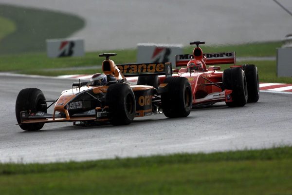 Jos Verstappen (NED) Arrows AMT A22 leads Michael Schumacher (GER) Ferrari F1 2001 Malaysian GP Sepang Sunday 18 March 2001 DIGITAL IMAGE